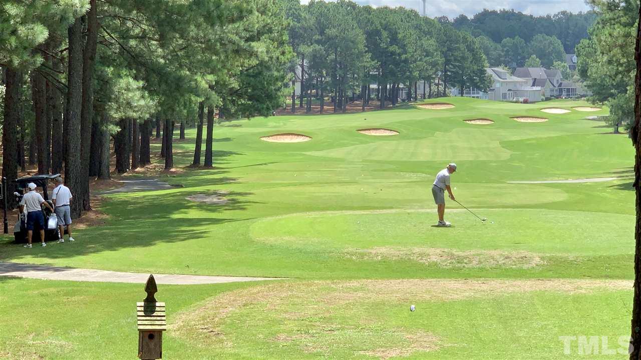 1217 Colonial Club Road Wake Forest, NC 27587 - Photo 27 of 30 This photos shows the golfer teeing off at the tee box. No worries about golf balls hitting your house!