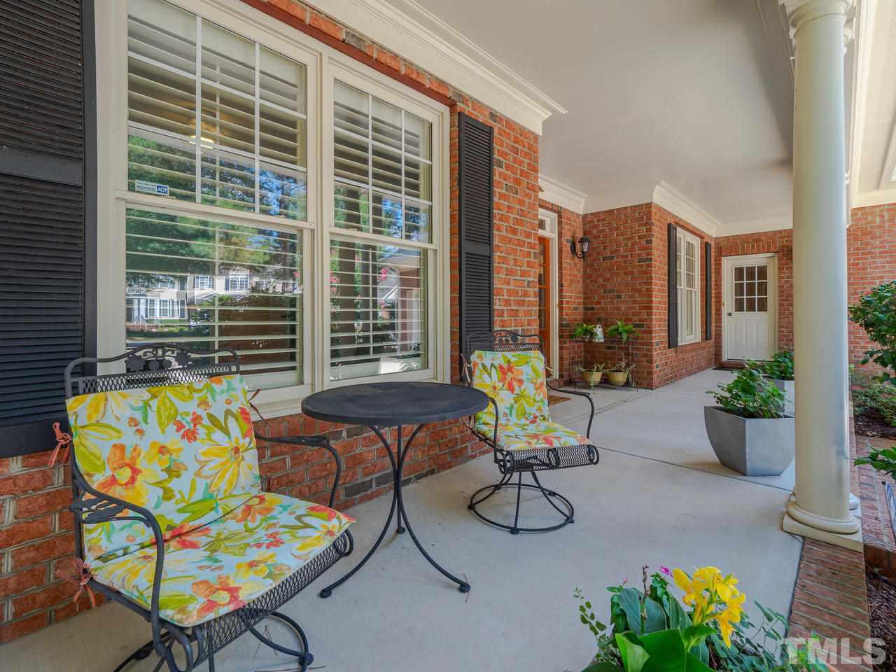 1217 Colonial Club Road Wake Forest, NC 27587 - Photo 4 of 30 A perfect porch to invite family and friends to socialize!