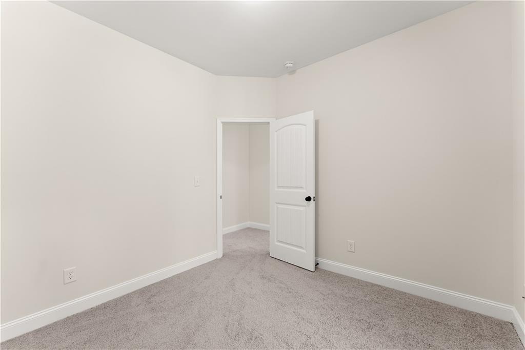 1203 Firethorne Pass Cumming, GA 30040 - Photo 23 of 37 a view of an empty room