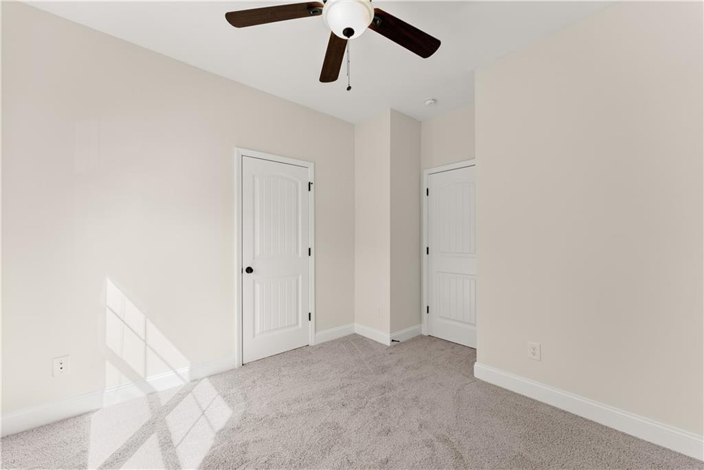 1203 Firethorne Pass Cumming, GA 30040 - Photo 25 of 37 a view of empty room with ceiling fan