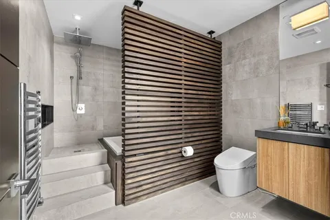 a bathroom with a toilet and a sink