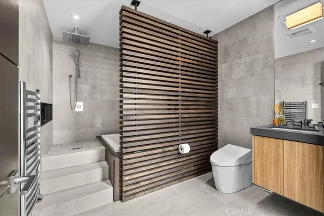 a bathroom with a toilet and a sink