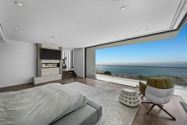 a bedroom with furniture and a flat screen tv