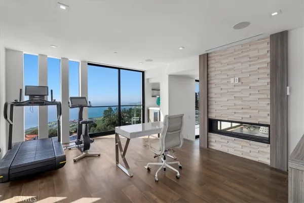 a bedroom with a bed and a television