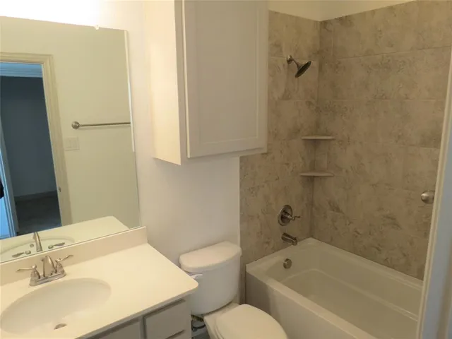 a bathroom with a sink toilet and bathtub