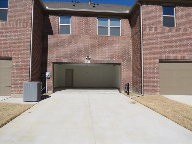 a front view of a house with garage