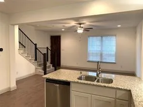 a kitchen with a sink and a window