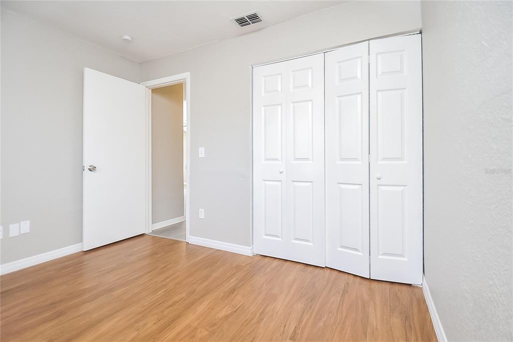 1625 Crossridge Drive Brandon, FL 33510 - Photo 12 of 16 a view of an empty room with wooden floor