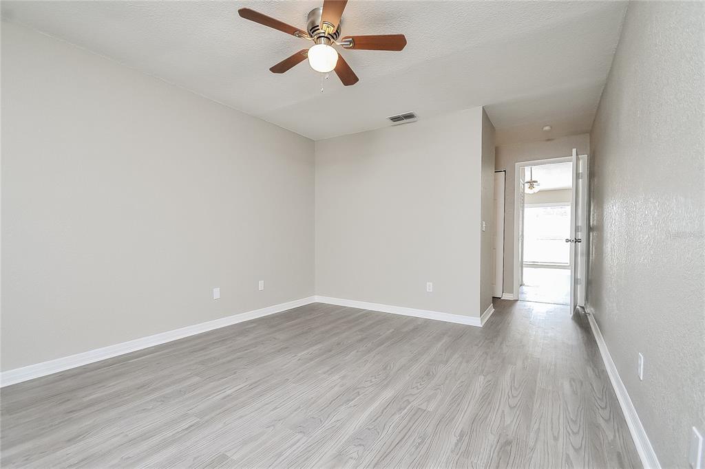1625 Crossridge Drive Brandon, FL 33510 - Photo 7 of 16 a view of an empty room and wooden floor