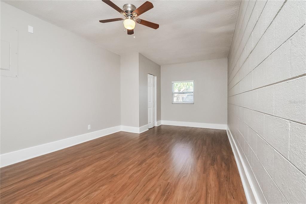 1625 Crossridge Drive Brandon, FL 33510 - Photo 10 of 16 wooden floor in an empty room with a window
