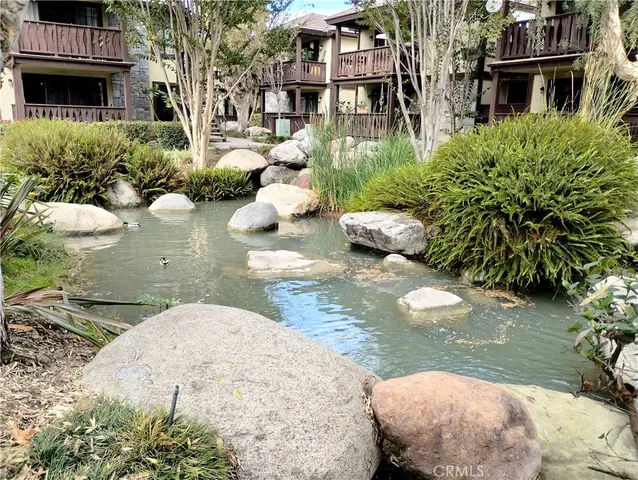 a view of backyard with seating space