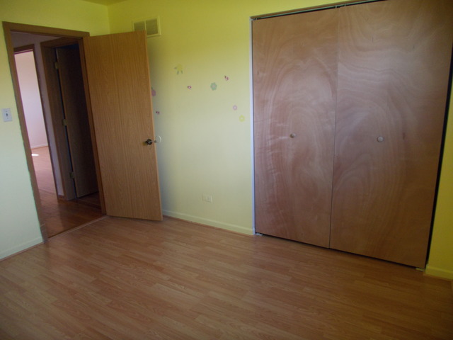 6200 Marsh Lane Matteson, IL 60443 - Photo 20 of 23 an empty room with wooden floor