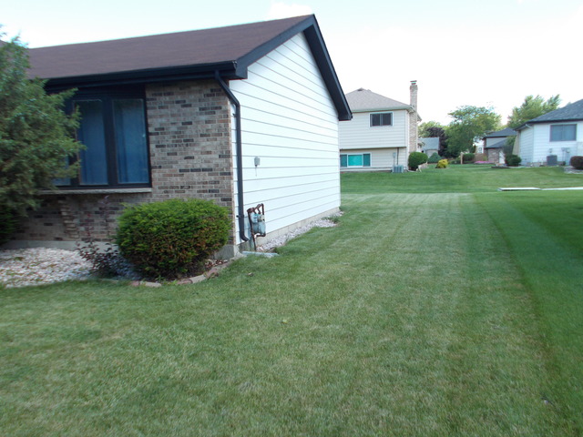 6200 Marsh Lane Matteson, IL 60443 - Photo 4 of 23 a view of a house with a yard and sitting area