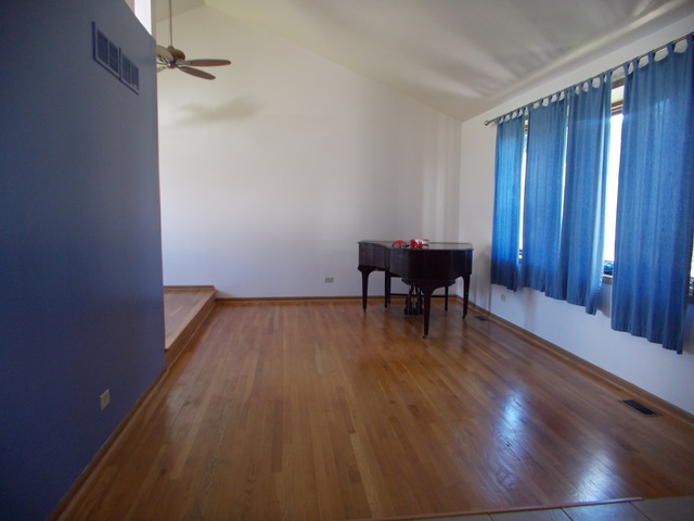 6200 Marsh Lane Matteson, IL 60443 - Photo 7 of 23 a view of a room with wooden floor staircase and a bathroom