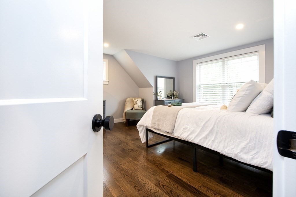 6 Seaview Road Bourne, MA 02562 - Photo 18 of 41 a bedroom with a bed and wooden floor