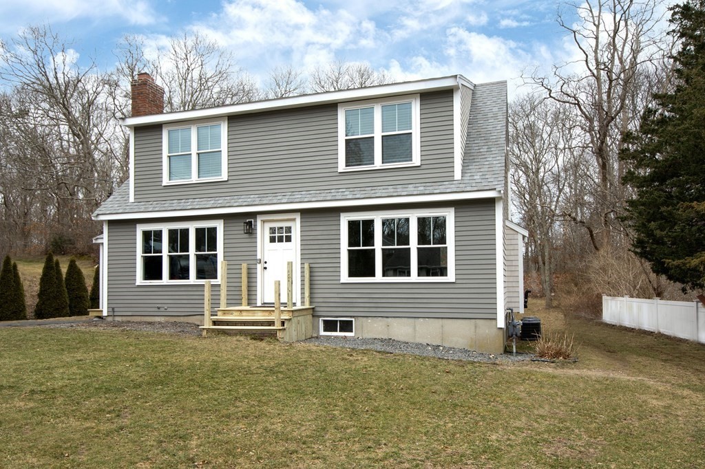 6 Seaview Road Bourne, MA 02562 - Photo 2 of 41 a front view of a house with a yard
