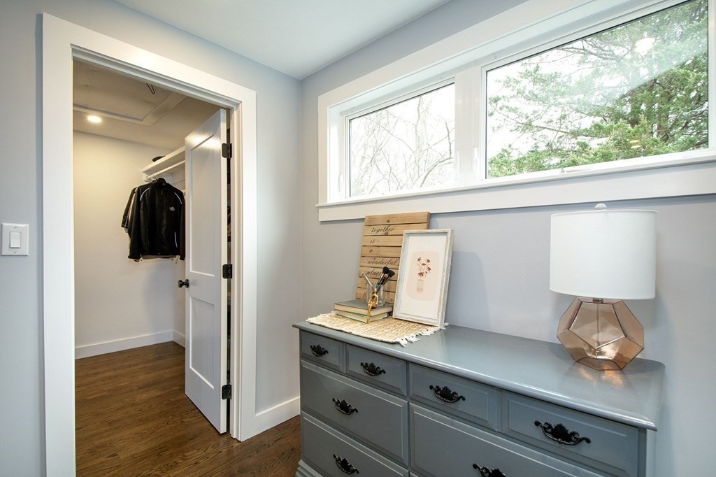 6 Seaview Road Bourne, MA 02562 - Photo 23 of 41 a hallway with front door wooden floor and cabinet