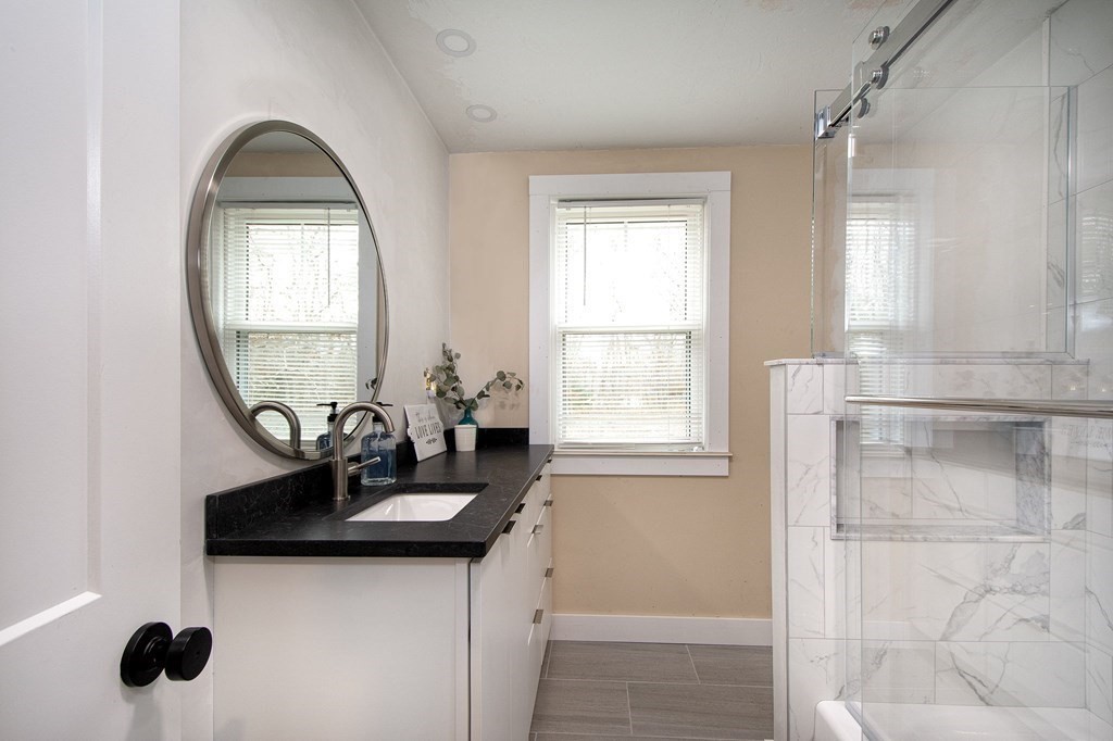 6 Seaview Road Bourne, MA 02562 - Photo 33 of 41 a bathroom with a sink and a mirror