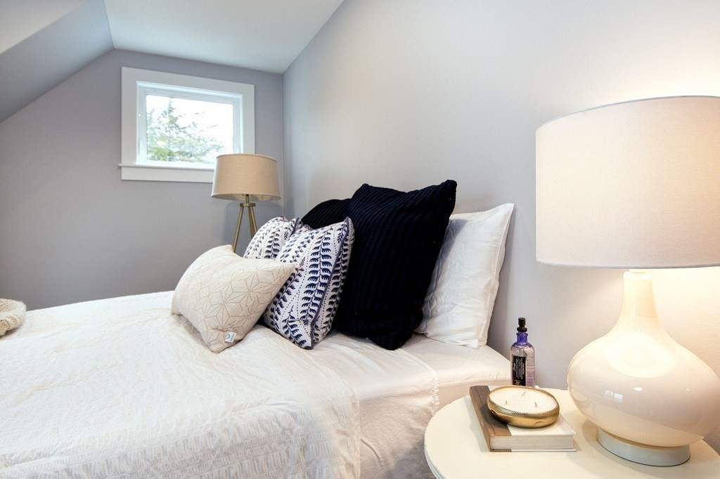 6 Seaview Road Bourne, MA 02562 - Photo 36 of 41 a bedroom with a bed and a night stand