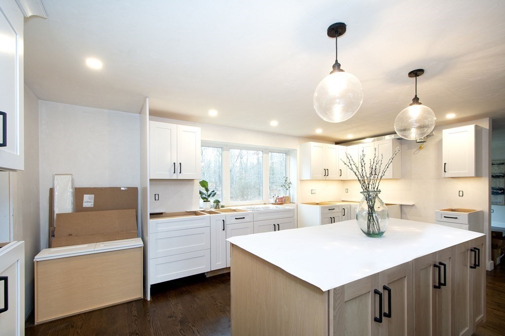 6 Seaview Road Bourne, MA 02562 - Photo 5 of 41 a kitchen with a sink a stove and cabinets