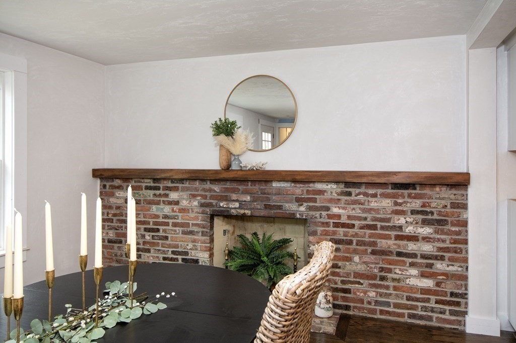 6 Seaview Road Bourne, MA 02562 - Photo 8 of 41 a living room with furniture and a fireplace