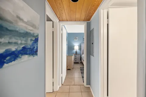 a spacious bathroom with a granite countertop sink and a mirror