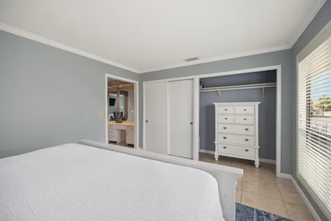 a bathroom with a sink vanity mirror and toilet