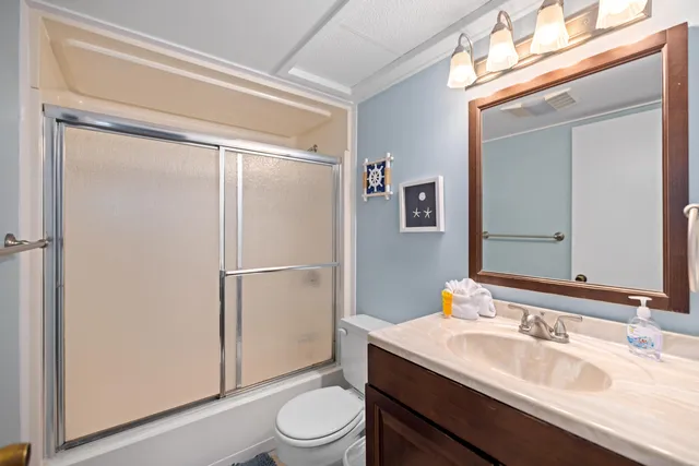 a view of a chairs and table in patio with a yard