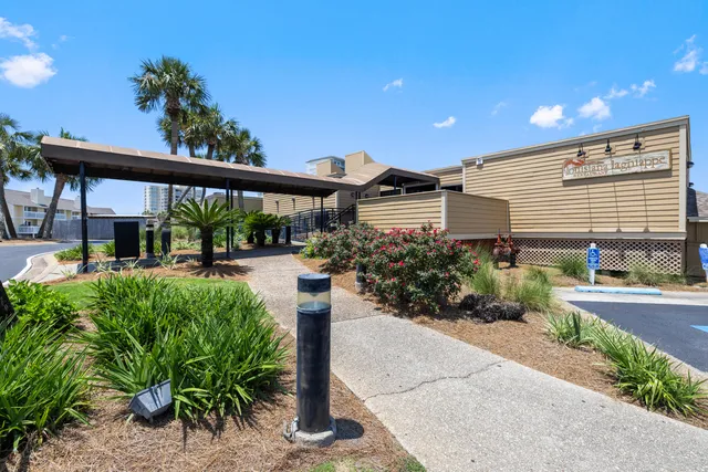a view of a house with wooden deck