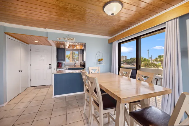 a open kitchen with a sink and refrigerator