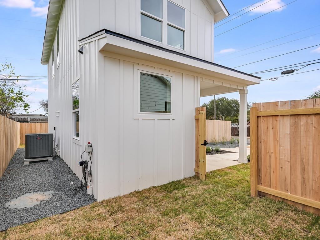 1116 Atkinson Road Austin, TX 78752 - Photo 27 of 27 View of property exterior with board and batten siding and a central air condition unit