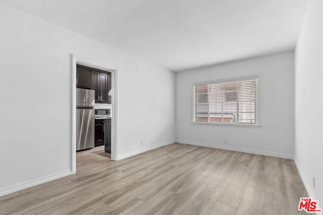 a view of a livingroom with wooden floor