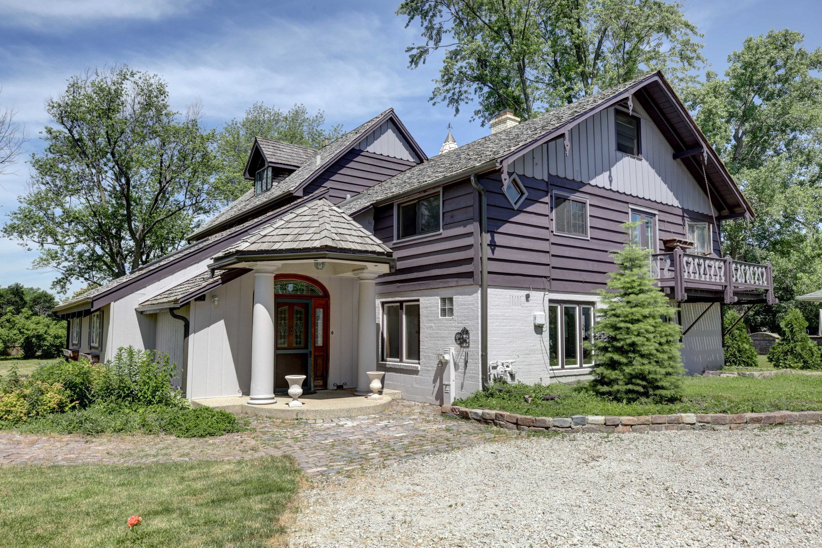 a front view of a house with garden
