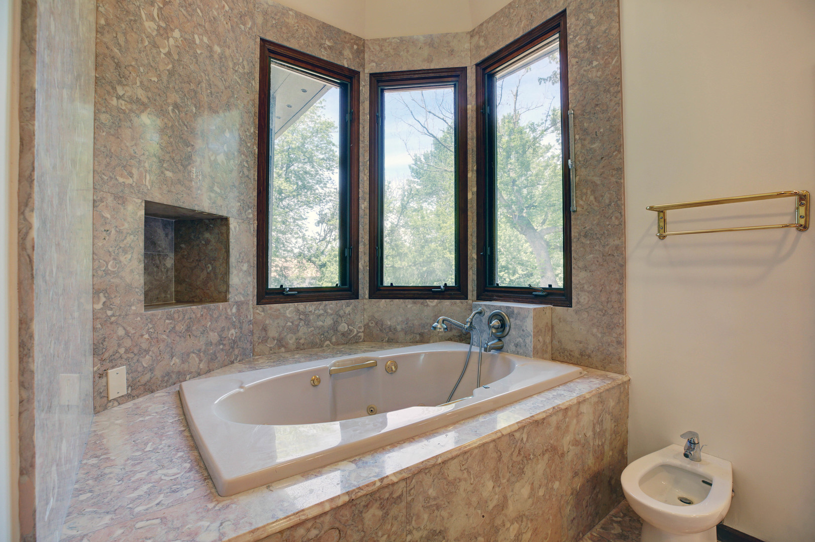 3150 Landwehr Road Northbrook, IL 60062 - Photo 23 of 43 a bathroom with a tub a sink and a window