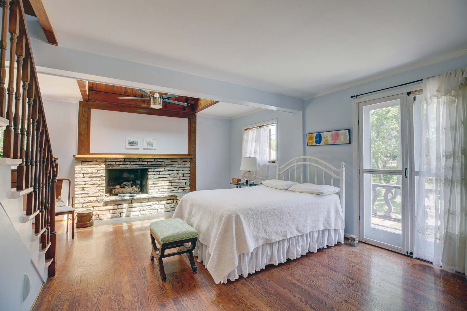 3150 Landwehr Road Northbrook, IL 60062 - Photo 25 of 43 a bedroom with a bed and a large window with wooden floor