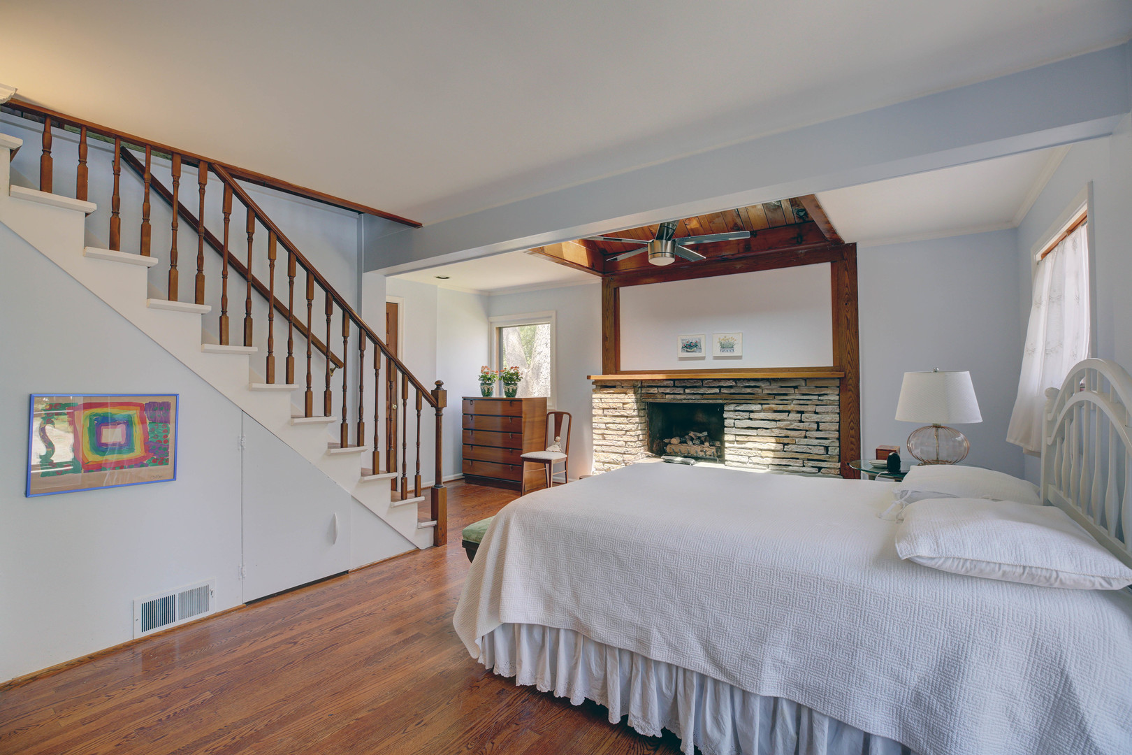 3150 Landwehr Road Northbrook, IL 60062 - Photo 26 of 43 a bedroom with a bed and a fireplace