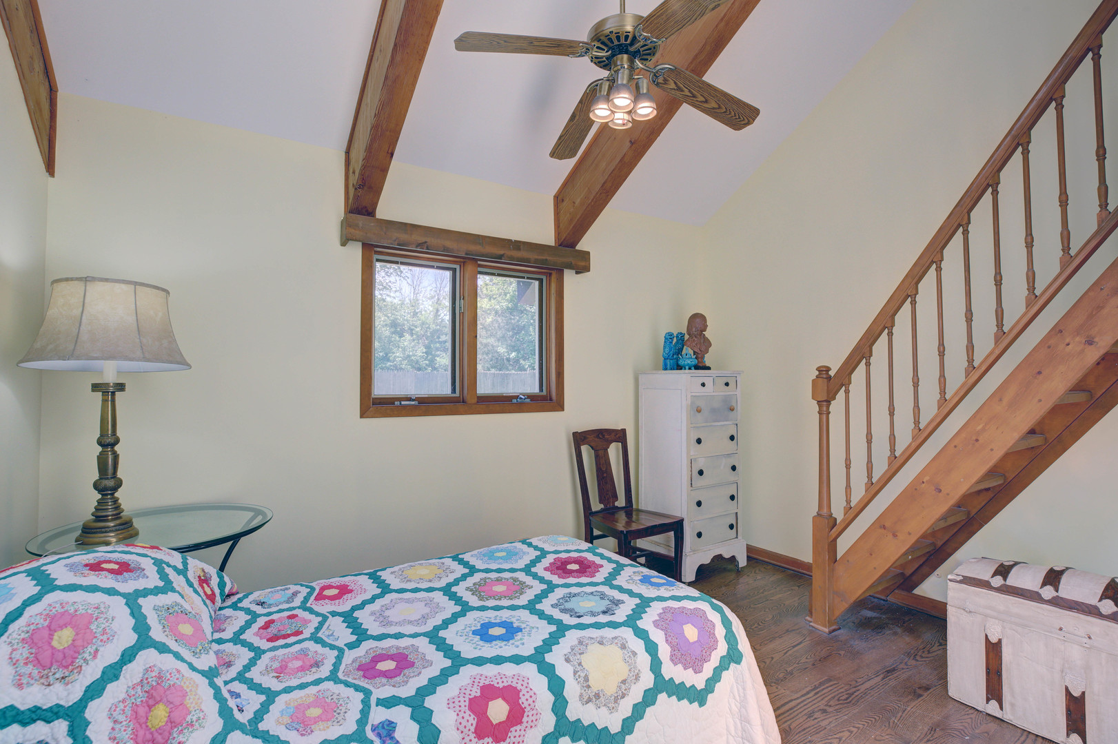 3150 Landwehr Road Northbrook, IL 60062 - Photo 34 of 43 a bedroom with a bed and a chandelier