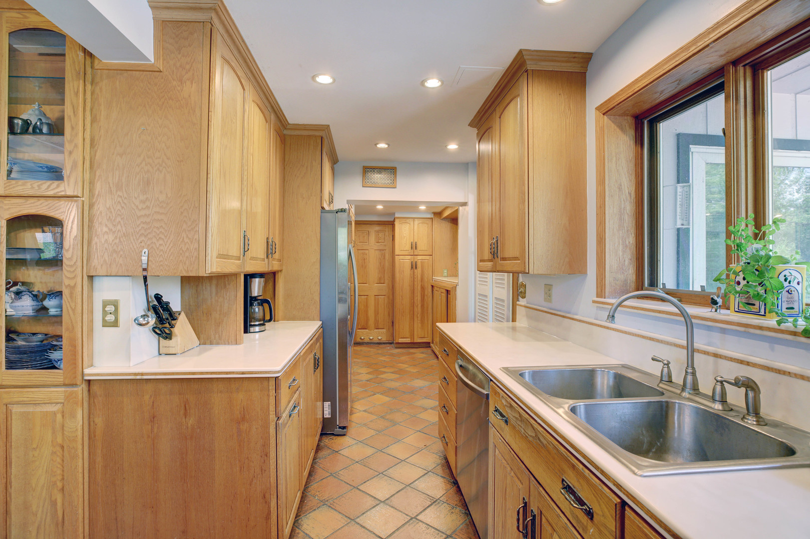 3150 Landwehr Road Northbrook, IL 60062 - Photo 38 of 43 a kitchen with stainless steel appliances granite countertop a sink stove and refrigerator