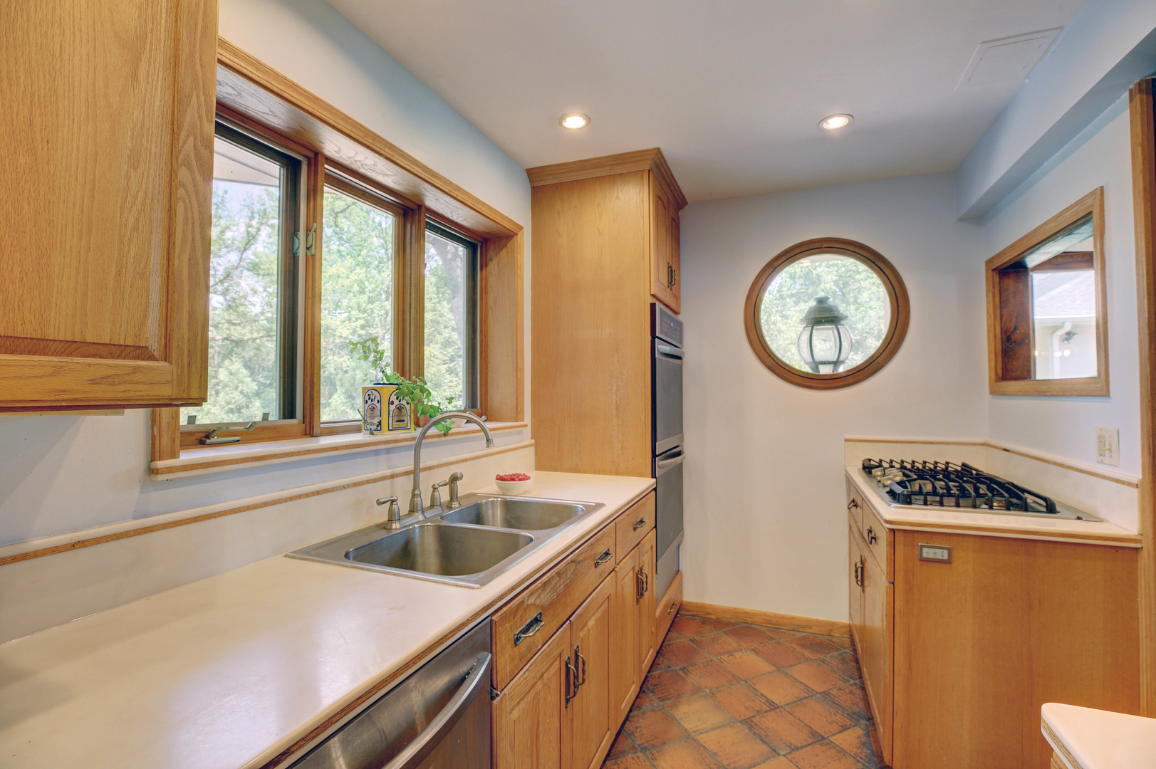 3150 Landwehr Road Northbrook, IL 60062 - Photo 40 of 43 a kitchen that has a sink a stove and a window
