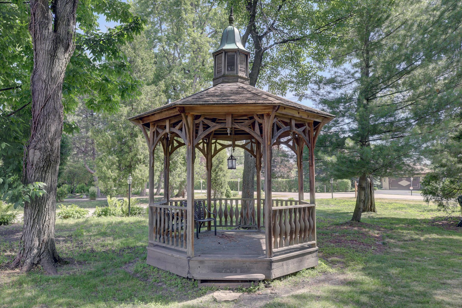 3150 Landwehr Road Northbrook, IL 60062 - Photo 5 of 43 a view of a wooden deck with a small yard plants and large tree