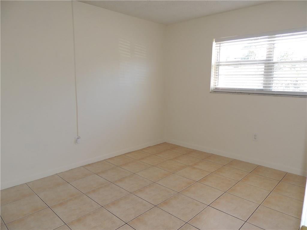 600 Southwest 2nd Avenue, Unit 143 Boca Raton, FL 33432 - Photo 11 of 14 an empty room with a window