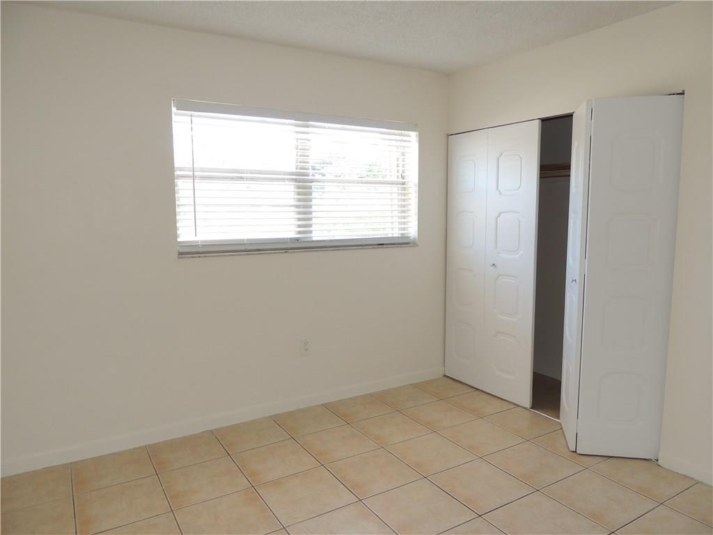 600 Southwest 2nd Avenue, Unit 143 Boca Raton, FL 33432 - Photo 12 of 14 an empty room with windows