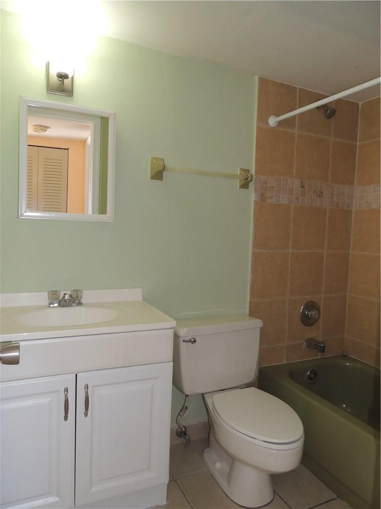 600 Southwest 2nd Avenue, Unit 143 Boca Raton, FL 33432 - Photo 13 of 14 a bathroom with a sink a toilet and shower