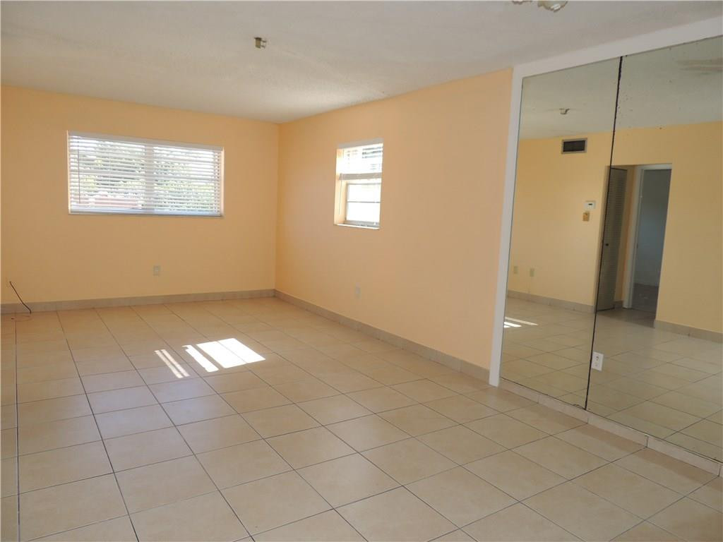 600 Southwest 2nd Avenue, Unit 143 Boca Raton, FL 33432 - Photo 5 of 14 a view of an empty room with a window