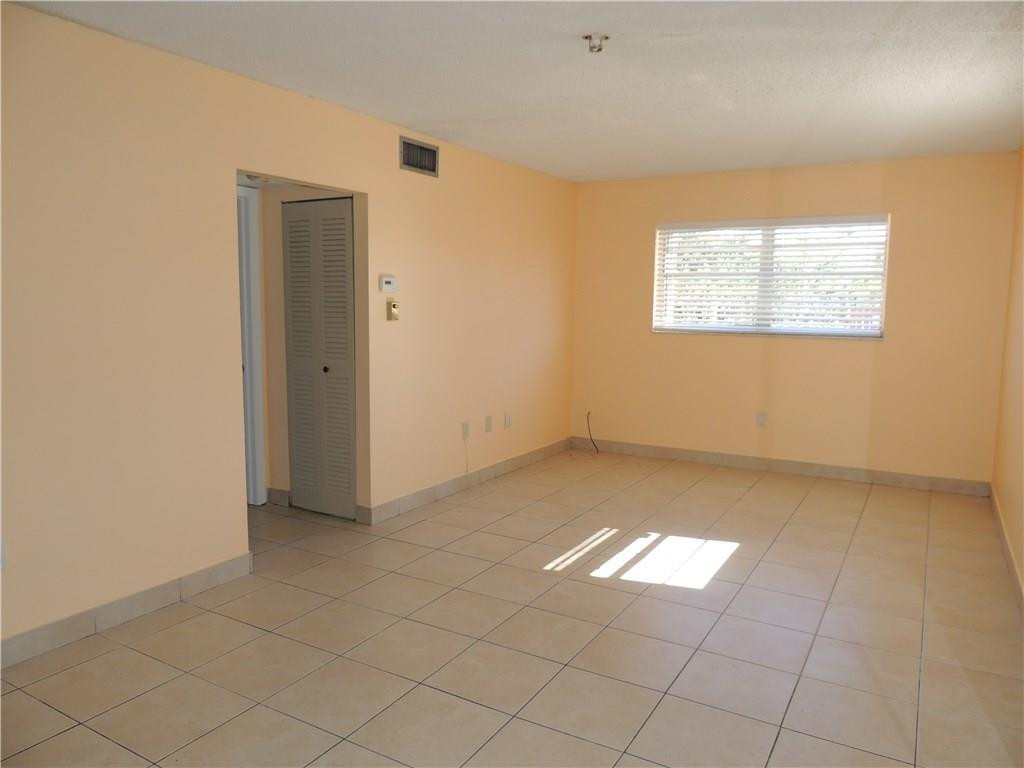 600 Southwest 2nd Avenue, Unit 143 Boca Raton, FL 33432 - Photo 6 of 14 an empty room with windows