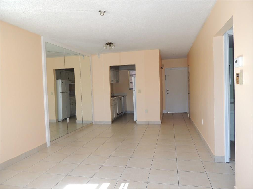 600 Southwest 2nd Avenue, Unit 143 Boca Raton, FL 33432 - Photo 7 of 14 a view of an empty room with closet and a window