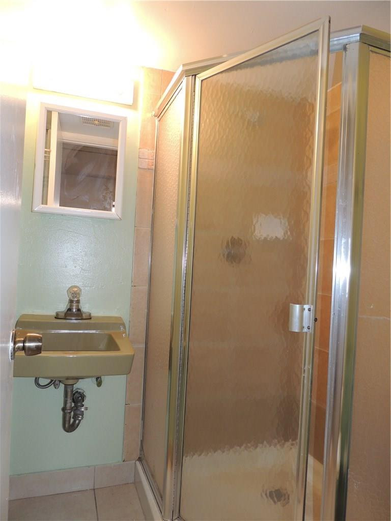 600 Southwest 2nd Avenue, Unit 143 Boca Raton, FL 33432 - Photo 10 of 14 a bathroom with a sink and a mirror