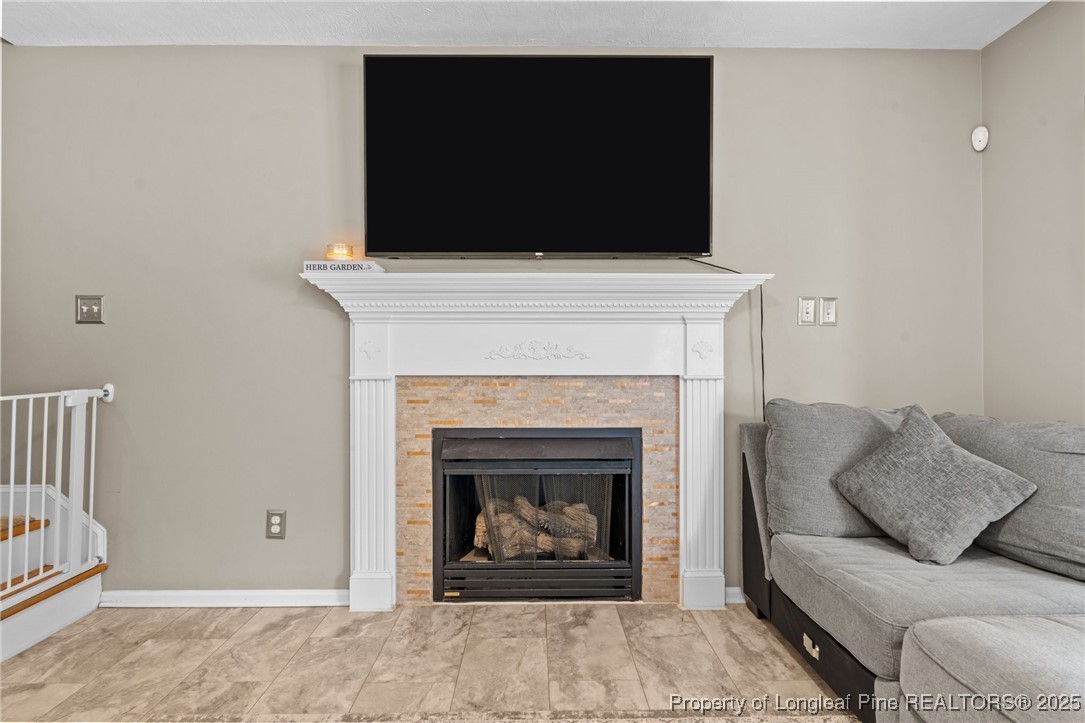 383 Yorkshire Drive Cameron, NC 28326 - Photo 16 of 49 a living room with furniture and a fireplace