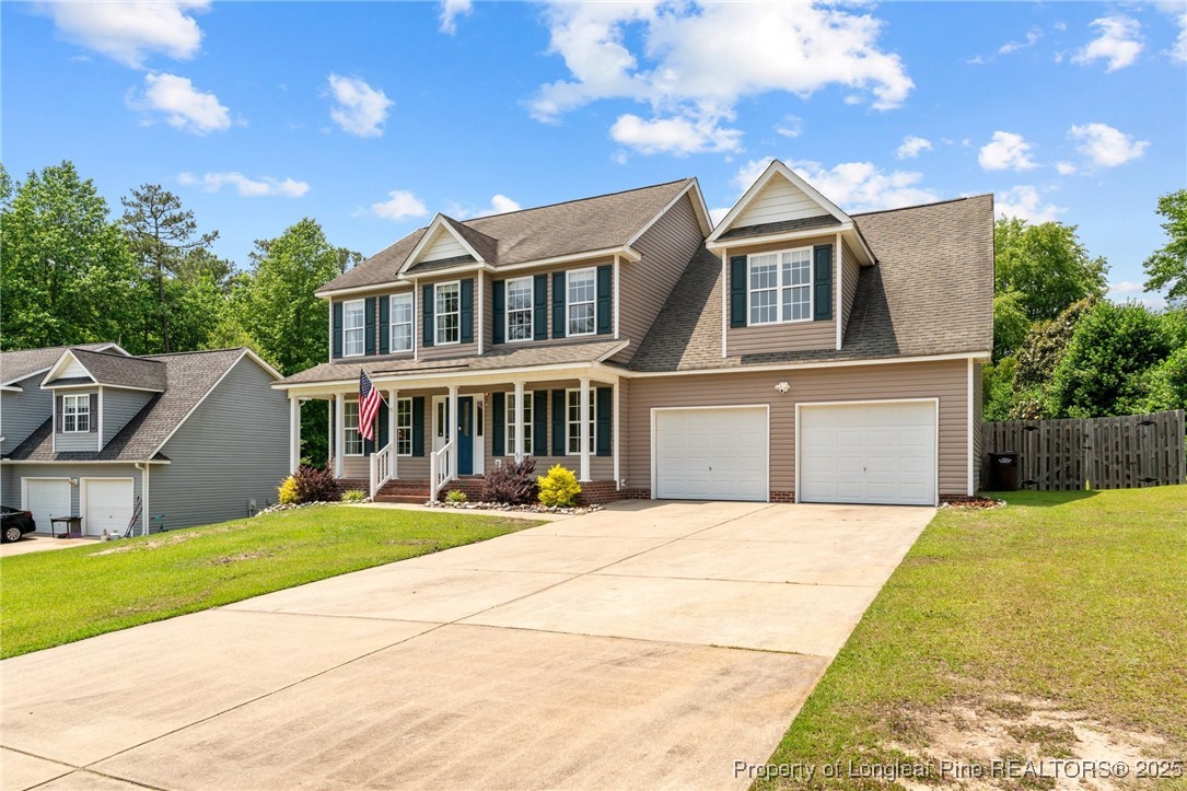 383 Yorkshire Drive Cameron, NC 28326 - Photo 2 of 49 a front view of a house with a yard