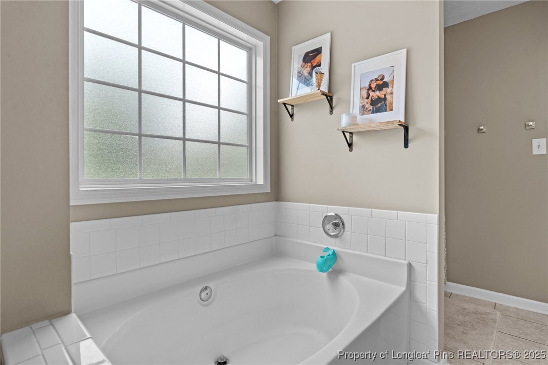 383 Yorkshire Drive Cameron, NC 28326 - Photo 26 of 49 a white bath tub sitting next to a window